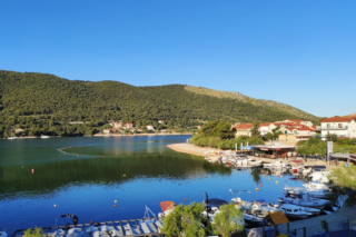 Marina and beach in Grebastica